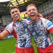 Tom Briscoe celebrates winning the Challenge Cup semi-final against St Helens with teammate Oliver Holmes