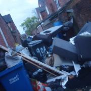 Rubbish left down the alleyways behind Raillway Road