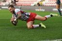 Gareth O'Brien drops over for a try for Leigh Leopards