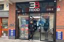 Hassan outside the family 3B Hood shop in Leigh