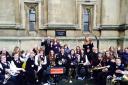 The Fred Longworth High School Brass Band at the base of Big Ben
