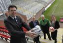At the Leigh Games launch are, from left, Andy Burnham MP, Simon Town, chief executive of Leigh Sports Village, Mike Hack, from Astley and Tyldesley Cycle Speedway Club, and Hayley Smith, editor of the Journal