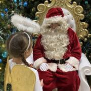 Santa and an angel in his grotto