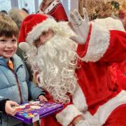 Santa Claus handing out gifts at Lakeview care home