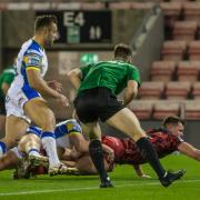 Kai O'Donnell reaches over for a try