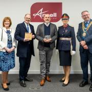 Mark Abbott receiving the award from the Lord Lieutenant, Leigh MP, and Wigan and Warrington mayors