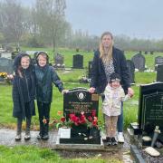 Charlotte with her three daughters at Nick's grave