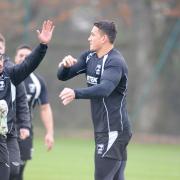 Shaun Johnson, left, and Sonny Bill Williams, warm-up for training at Leigh Sports Village. Pictures by Mike Boden