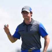 First-round leader Rory McIlroy will hope the testing early-morning weather conditions will prevent anyone overtaking him before he tees off in the afternoon of the second day at Royal Liverpool