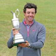 Rory McIlroy lifts the iconic Claret Jug.