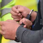 A man being arrested on suspicion of drug dealing
