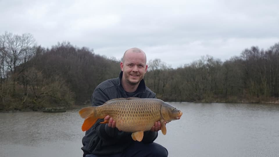 Andrew Sangam with one of the common carp he caught at Worthington Lakes
