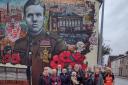 Graffiti artists paint Remembrance Day mural in memory of Leigh veteran