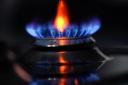 A gas hob burning on a stove (Andrew Matthews/PA)