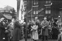A flag being raised on Market Street, Tyldesley, during War Savings Week in 1943                                  Picture: Wigan and Leigh Archives and Local Studies