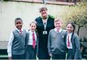 Headteacher Clare Oxborough with pupils at Leigh CE Primary School