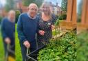 Resident, Bill Dootson, and experience coordinator, Kim Calland, enjoy the results of their gardening