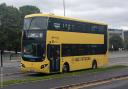 A yellow V1 bus in Leigh