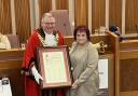 Outgoing mayor of Wigan Coun Kevin Anderson hands over the office to Coun Debbie Parkinson