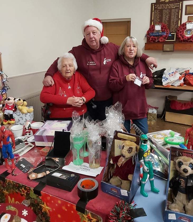 Volunteers on a stall at the Christmas fair