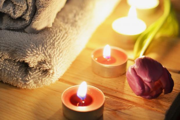 Leigh Journal: A pile of towels, candles and a tulip. Credit: Canva
