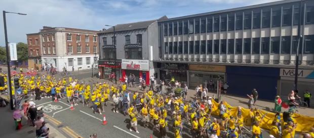 Leigh Journal: Swedish fans walking from Civic Square to Leigh Sports Village