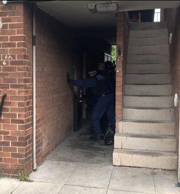 Leigh Journal: Police officers conducting a drugs raid on Linden Grove