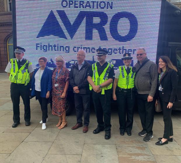 Leigh Journal: Assistant Chief Constable Chris Sykes with Emily Higham, Leader of the Council David Molynuex and other partners
