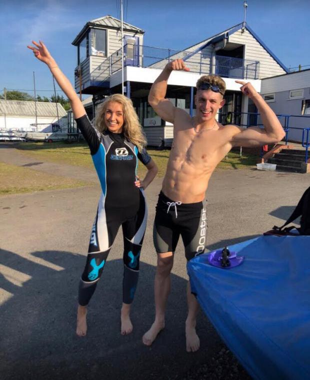Leigh Journal: Megan and Haydn, open water swimming at Leigh and Lowton Sailing Club, where Haydn also did safety rescue boat duties