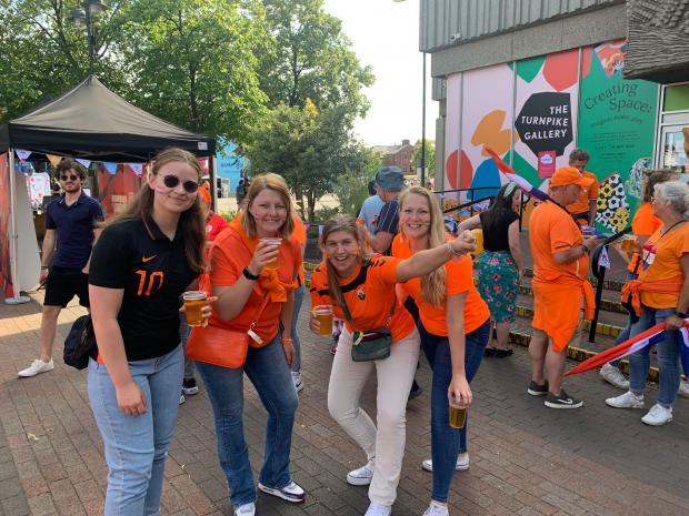 Leigh Journal: Dutch fans having a drink at Leigh's town centre fan zone