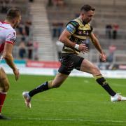 Ryan Brierley dabs a kick forward for Leigh Centurions against St Helens at the Totally Wicked Stadium on Thursday night. Picture: Richard Walker
