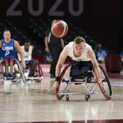 Leigh's Gregg Warburton pursues the ball for the ParalympicsGB wheelchair basketball team against reigning champions USA in Tokyo. Picture: imagecomms