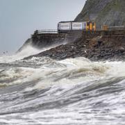 A train heads along the west coast between Whitehaven and Carlisle in England after Storm Dudley. Photo taken on Thursday, February 17, 2022. Photo via PA.