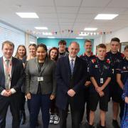 James Grundy with staff and students at Leigh College