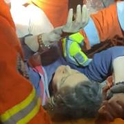 Steven Pennington assisting with the rescue of a woman from a collapsed building in Turkey