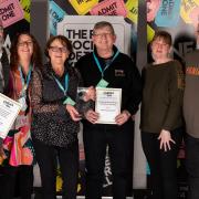 The team at Leigh Film Society with their Cinema For All awards and certificates