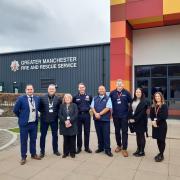 Atherton High School headteacher Ben Layzell, Coun John Harding, Coun Debra Wailes, County Fire Officer Dave Russel, Rik Tapper and staff from Wigan Council and GMFRS Safety Centre.