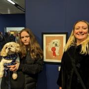 Abi and Ollie with Lisa in front of her touching portrait to the Shi Apso