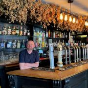 Barry Smith behind the bar at Hop and Hazlewood