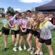 Pupils at Bedford Hall primary enjoying the colourful fun run