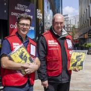 Greater Manchester Mayor Andy Burnham selling the magazine with vendor, Colin, in Manchester city centre