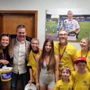 Members of Wigan & Leigh carers with Leigh owner Derek Beaumont