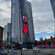 ET7 billboard on a skyscraper off Deansgate in Manchester