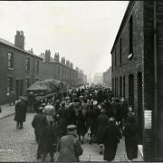 Workers from Anchor Cable Works leaving the factory at the end of their shift Picture: Wigan & Leigh Local Archives & Local Studies