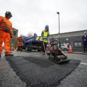 Esther McVey MP filling in a pothole on Bengal Street